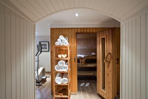 an archway in a room with a kitchen with plates on shelves at Best Western Plus Hotel Villa D'est in Strasbourg