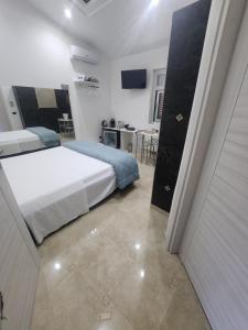 Postel nebo postele na pokoji v ubytování B&B GRECALE Suite & Spa