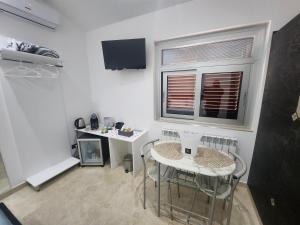 TV a/nebo společenská místnost v ubytování B&B GRECALE Suite & Spa
