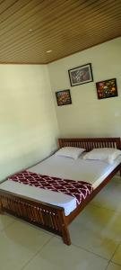 Letto o letti in una camera di Ayurnest Pool Resort Wayanad