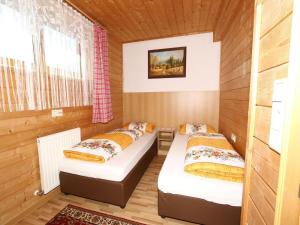 A bed or beds in a room at Apartment in Mayrhofen with a balcony