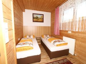A bed or beds in a room at Apartment in Mayrhofen with a balcony