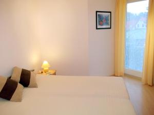 Ένα ή περισσότερα κρεβάτια σε δωμάτιο στο "Meeresrauschen-Whg-05"