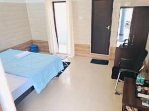Canara Vibes客房内的一张或多张床位