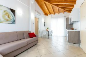 a living room with a couch and a table at Villaggio Sant' Andrea in Caorle