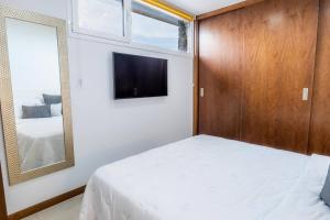 En eller flere senge i et værelse på Estancia Sofia