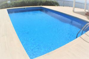 The swimming pool at or close to Impresionantes vistas del mar en Roses, Canyelles AV-37