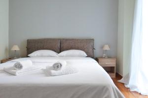 Posteľ alebo postele v izbe v ubytovaní Patisia, a minimal apartment