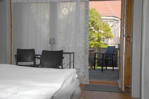Ένα ή περισσότερα κρεβάτια σε δωμάτιο στο Ferienhaus Zur grauen Maus in Arnstadt mit Parkplatz und Garten