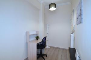 A television and/or entertainment centre at A heart apartment at Skouze Hill, Dirrachiou