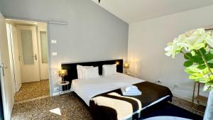 Ένα ή περισσότερα κρεβάτια σε δωμάτιο στο Residence Surian