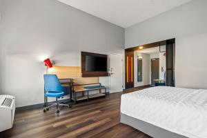 Tru By Hilton Rogers Bentonville客房内的一张或多张床位