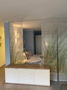a mirror in a room with a bed in it at Seestraße 70, Ap 30 in Zingst