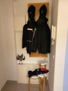 two jackets hanging on a wall in a room at Seestraße 70, Ap 30 in Zingst +3 photos