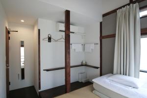 a bedroom with a bunk bed and a window at hanare in Tokyo