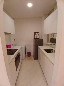 Η κουζίνα ή μικρή κουζίνα στο VORTEX SUITS KLCC by MMHB