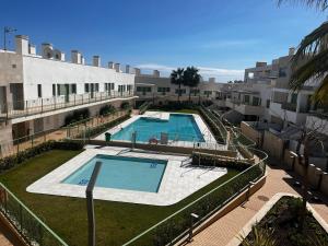 an aerial view of a building with a swimming pool at Cozy new penthouse apartment Cantal Homes in Mojácar