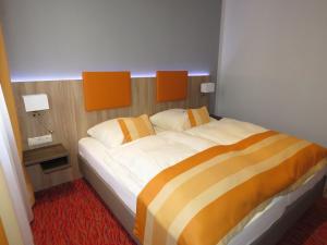 Postel nebo postele na pokoji v ubytování Hotel Trutzpfaff