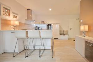 a kitchen with a sink and a counter top at FeWo Grosse Nr 6 in Kellenhusen