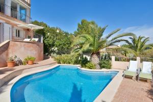 a swimming pool in the backyard of a house at Villa with incredible sea views and pool Up To 7 in Andratx