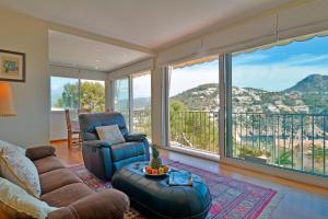 a living room with a couch and a chair at Villa with incredible sea views and pool Up To 7 in Andratx