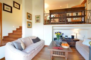 a living room with a couch and a table at Villa with incredible sea views and pool Up To 7 in Andratx +16 photos