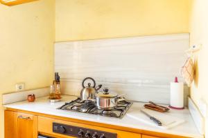 Kuchyň nebo kuchyňský kout v ubytování Palma Town house at 300mts to Beach + 17 fotografií