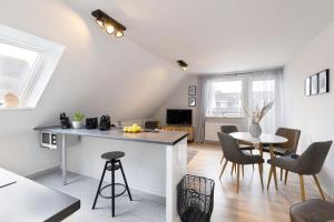 TV a/nebo společenská místnost v ubytování Appartement Tina Kieler Straße 16a APPARTO Grömitz
