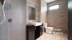 a bathroom with a shower and a sink and a mirror at Austin Glenmarie Home in Johor Bahru +22 photos
