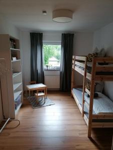 Postel nebo postele na pokoji v ubytování Ferienwohnung Tettenbusch in der Waldstadt Prüm Naturpark Eifel