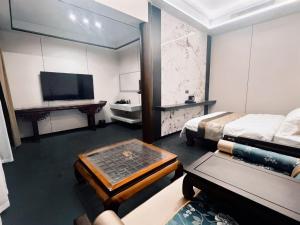 Llit o llits en una habitació de Yongjuxiang Mansion
