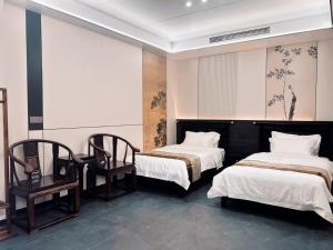 Llit o llits en una habitació de Yongjuxiang Mansion