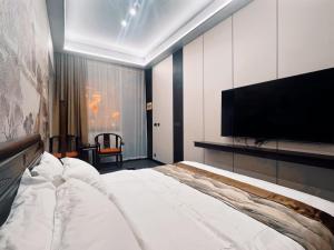 Llit o llits en una habitació de Yongjuxiang Mansion