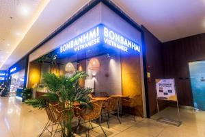 a restaurant with a table and chairs in a building at The Vibrant Condo Cool Stays 4254 Memorable Swim Gym Park Laugh in Manila +99 photos