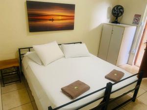 Postel nebo postele na pokoji v ubytování Pousada Quinzitão - O seu local de descanso! + 49 fotografií