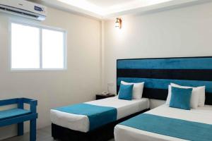 Beach Corridor Hotel & Spa with Free Airport shuttle客房内的一张或多张床位