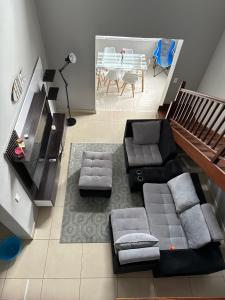 a living room with a couch and a table at YA Eagle Wings Self Catering Shared Single room Apt B in Cape Town