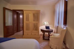 A bed or beds in a room at Alle Porte di Assisi