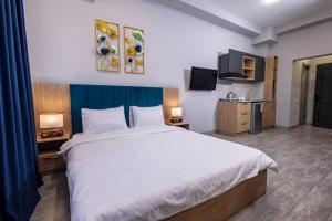 Rúm í herbergi á Horizon Hotel Yerevan