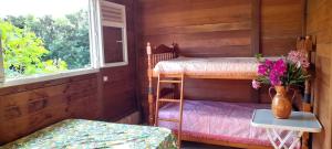 Postel nebo postele na pokoji v ubytování Chambre Maison Kumba