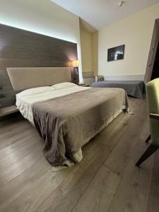 Una cama o camas en una habitación de Hotel Giardino