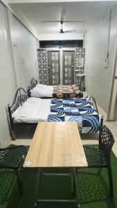 Letto o letti in una camera di Mysuru-hotel