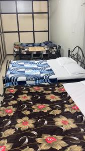 Letto o letti in una camera di Mysuru-hotel