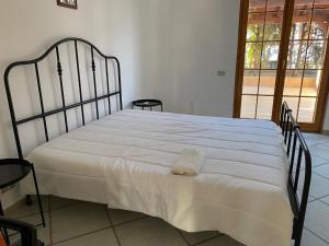 Katil atau katil-katil dalam bilik di Superbe villa à Porto empedocle