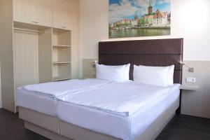 Postel nebo postele na pokoji v ubytování Viva Hotel Lübeck