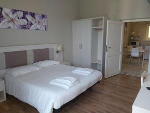 Postel nebo postele na pokoji v ubytování Lodges le Mura