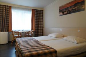 Voodi või voodid majutusasutuse Hotel Prins Boudewijn toas
