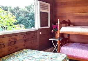 Postel nebo postele na pokoji v ubytování Chambre Maison Kumba