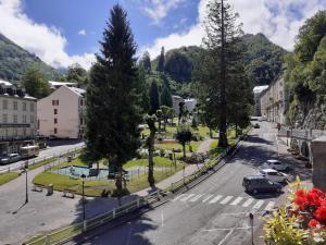 a view of a street in a town with trees at Beau Soleil in Eaux-Bonnes