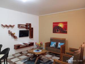 a living room with a couch and a table at Appartement N01 T3 in Oiapoque